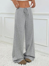 Grey Orvella LumaTide Pants with a white blouse and camel loafers for casual-cool outfits.