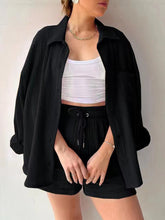 Model in black Own Your Lane Luxe Set paired with strappy black sandals for date night and rooftop cocktails.