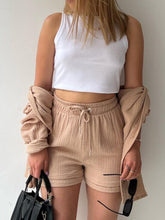 Model in camel Own Your Lane Luxe Set with woven mules for casual afternoons and coffee runs.