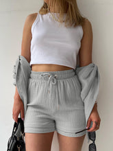 Model styled in light gray Own Your Lane Luxe Set with cozy slippers for at-home lounging and relaxing weekends.