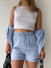 Model in misty blue Own Your Lane Luxe Set, front view.