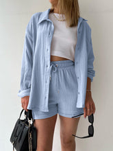 Model styled in misty blue Own Your Lane Luxe Set with clean white trainers for travel days and park strolls.