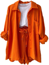 Own Your Lane Luxe Set in orange, front view with button-up top and elastic waist shorts.