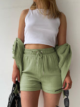Model in sage Own Your Lane Luxe Set with tan slides for beachside brunch and backyard hangs.