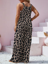 Back view of Panthorlisa Overalls highlighting adjustable wide straps and leopard print fabric.
