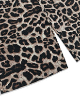 Close-up flatlay of Panthorlisa Leopard Overalls showcasing the bottom hem, precise stitch detail, and soft, high-quality leopard print fabric texture.