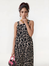 Model wearing Panthorlisa Wide-Leg Leopard Overalls, front view with adjustable wide straps and side pockets visible.