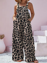 Model wearing Panthorlisa Leopard Wide-Leg Overalls, front view with hands in pockets.