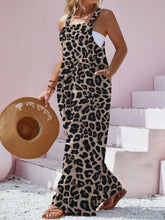 Side profile of model in Panthorlisa Leopard Overalls showing the relaxed wide-leg silhouette and flowing fit.