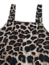 Close-up flatlay of Panthorlisa Leopard Overalls showing the adjustable wide shoulder straps, button detailing, and leopard print detail.