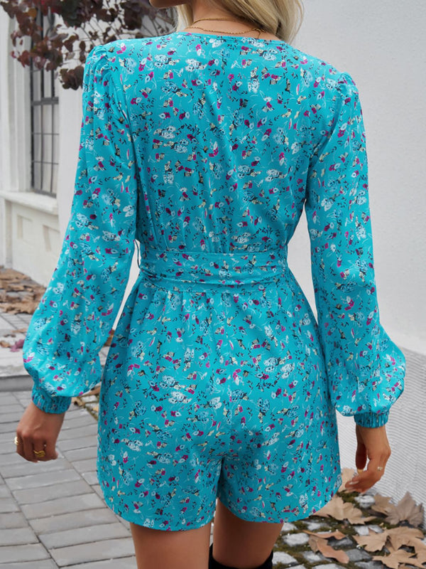 Back view of Floravelle™ Tied Romper with balloon sleeves in pastel blue.
