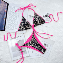 Pink leopard print halter neck tie side bikini set front flat lay view 