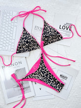 Pink leopard print halter neck tie side bikini set front flat lay view zoomed in