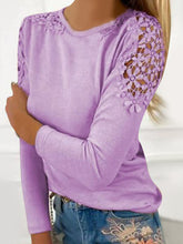Model styled in pink purple FloraFrost™ Tee with embroidered jeans and accessories for a formal look.