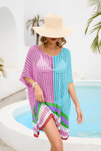 Pink Model in Valenyra openwork contrast cover-up raising hem, styled with beach hat