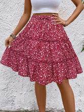 Red Florévyn Midi Skirt with floral print, frill tiers, and ruffled hem styled with white tube top