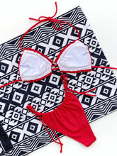 Red frill trim halter neck bikini set back flat lay view