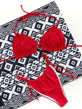 Red frill trim halter neck bikini set front flat lay view