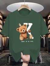Regal K Bear Green Graphic Tee on hanger in luxury closet.