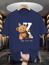 Regal K Bear Navy Blue Graphic Tee on hanger in luxury closet.
