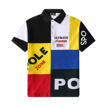 Front view of RegaliaSport Elite Multi-Color Embroidered Polo in Black showing color-block design, black collar, and multicolor placket.