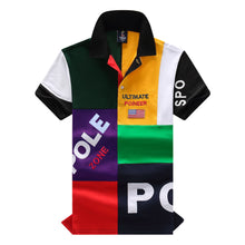 Front view of RegaliaSport Elite Multi-Color Embroidered Polo in Green showing color-block design, black collar, and multicolor placket.