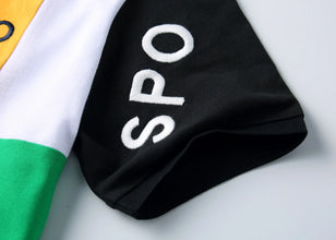 Close-up of RegaliaSport Elite Polo sleeve embroidery and detailed stitching on patchwork sleeve.