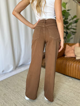 RFM Wide Leg Jeans back view of pockets and frayed bottom hem in coffee brown.