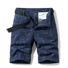 Dark blue abstract print men’s safari Bermuda shorts front view.