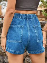 Rear perspective of vibrant royal blue high-waist denim shorts emphasizing the pocket shape.