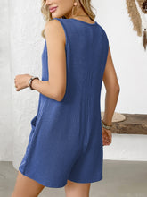 Back of romper shown in royal blue, highlighting shape-retaining fabric and minimalist cut—bright yet balanced.