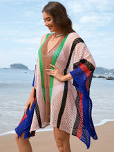 Side view of royal blue openwork color block plunge cover-up highlighting lightweight openwork knit and flattering silhouette