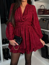 Model styled in rust Ilysséa mini dress with ankle boots and gold jewelry.