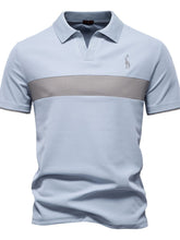Front view of light blue contrast polo with giraffe embroidery and v-neck collar