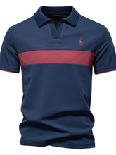 Front view of navy blue contrast polo with giraffe embroidery and v-neck collar