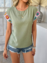 Model styled in sage CrochetCharm Top with distressed jean shorts, sneakers, and accessories for a complete look.