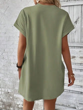 Back view of Sage Rahluna Mini Tee Dress highlighting relaxed silhouette and cuffed sleeves.