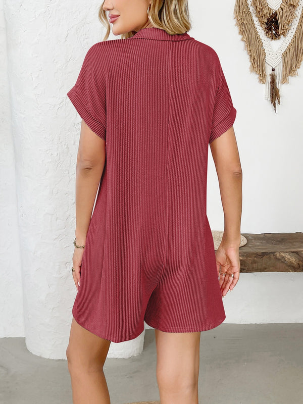 Back view of scarlet romper highlighting collar and relaxed fit.