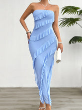 Model wearing the Seraflore™ Maxi Dress in Light Blue, featuring a strapless neckline and cascading ruffle trim.
