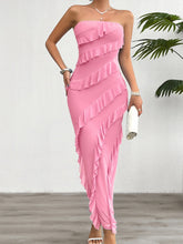 Model wearing the Seraflore™ Maxi Dress in Pink, featuring a strapless bodice and cascading ruffle detail.