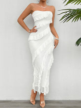 Model styling the White Seraflore™ Maxi Dress with gold hoop earrings, nude strappy heels, and minimal bracelets.