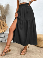 Seravellea Black frill midi skirt side view showcasing frill waist and side slit detail