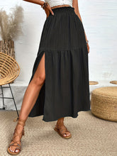 Seravellea Black frill midi skirt side view showcasing side slit detail and lightweight drape