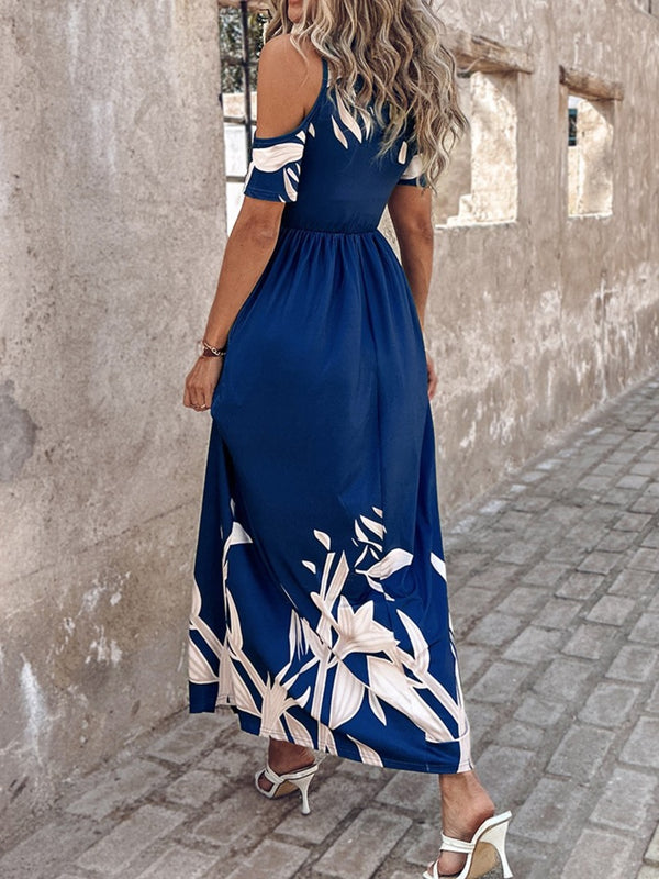 Back view of a model wearing the Navy Blue Serene Xymeraeh™ Maxi Dress with tan heels, showcasing the cold shoulder detail and flowing silhouette.