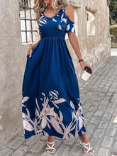 Woman wearing the Navy Blue Serene Xymeraeh™ Cold Shoulder Maxi Dress on a coffee run, styled with simple accessories and tan heels for a casual-chic outing.