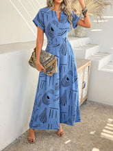Serenoor jumpsuit in blue perfect for beachside gatherings, styled with tan accessories.