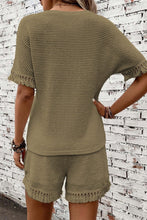 Model showcasing a back view of the army green Shakaluxe set with tassels.