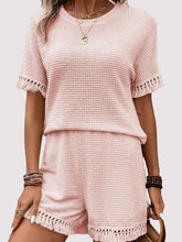 Model styled in blush pink Shakaluxe set with accessories.