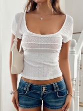 Model side profile wearing the white  lace detail square neck short sleeve t-shirt, highlighting delicate lace trim and relaxed fit.