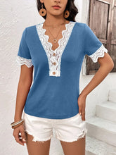 Model wearing a sky blue Lace Detail V-Neck Short Sleeve T-Shirt with wavy lace trim neckline and sleeves, styled with light-wash jeans in a sunny outdoor setting.